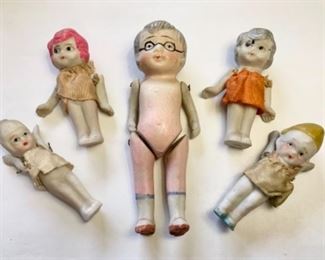 #63) $25 NOW 50% off (was $50 ) for group of 5 Vintage Bisque Dolls includes : Large 5” tall jointed Grandma Doll with painted glasses (she has wear on her back as shown) 2 cute girls with moveable arms and Pink and Silver Hair (paint mark on her head) 2 other jointed dolls. Smaller Dolls have original clothing and measure approx 3 “ tall. (1 of 2 views) 