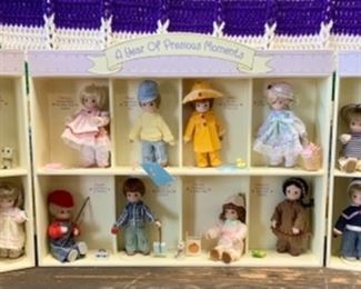#82) $60 NOW 20% (was $75) A Year of Precious Moments . Dolls , Display case and accessories. 29.5’’wide x 15” tall. (1 of 2 views) 