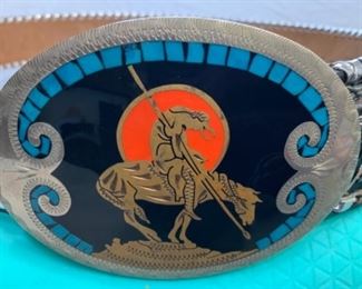 #125) $75 Vintage Johnson and Held of Denver, Colorado Belt Buckle with inlaid stones and BELT.  Probably nickel. 100% Hand Crafted Western Buckle by Johnson and Held. End of the trail. Buckle measures Approx 2 3/4” x 3 3/4”. Belt is by Mallory waist 36 with Eagle and turquoise flowers. (1 of 2 views) 