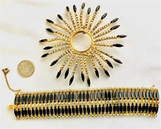 #150) $87.50 NOW 30% OFF (was $125 ) Gigantic Vintage Brooch with Black Glass and AB accents plus wide multi stoned Bracelet. Pin Measures approx 5 “ in diameter and bracelet measures 8 ‘’ in length and approx 1 1/2 “ wide. Not cleaned and in great vintage condition. (1 of 3 views) 