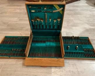 Mid-Century Modern Bronze Flatware Set with box.   Service for 12. Case is solid Teakwood.  Purchased at the Thailand Pavilion at the 1964 NY World's Fair.