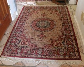 #26. $60.00. Small rug 63” X 45”