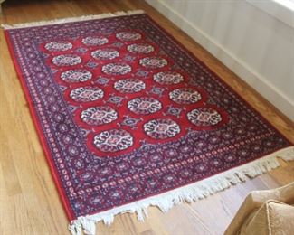 #43. $60. Area rug tag bukara style reads Oasis 64” X 45”