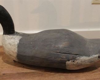 #73. $225.00. Long duck decoy as is cracks head was reattached 13”h X 28”w X 9”d