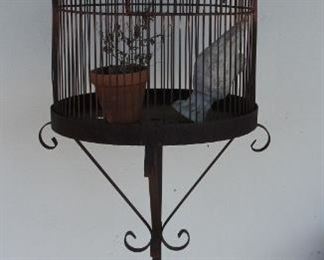 #79. $125.00. Iron Bird cage 67” X 23”