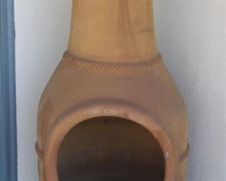 #80 . $80.00. Terra cotta Chiminea standing fire pit. 48” X 19”