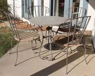 #82. $100.00. Patio table with 4 chairs crack to top weathered T 26” X 24”diameter / C 38”h X 18”w X 19”d