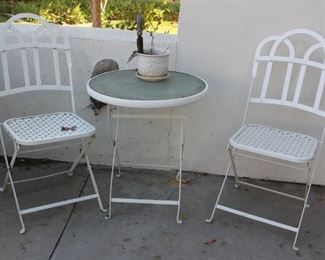 #83. 50.00. iron table with chairs T 26”h X 24”diameter / C 38”h X 18”w X 19”d