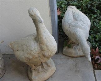 #86. $125.00. Pair concrete ducks tallest 22”h smaller 12”h