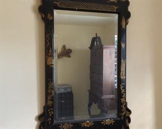 Antique black and gold painted mirror.