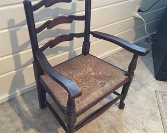 Low cane ladderback chair.