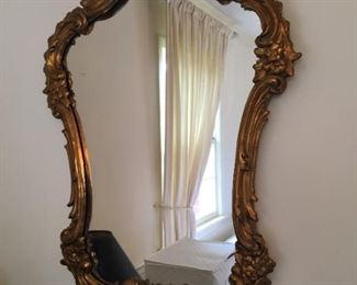 Gilded mirror in unusual size.