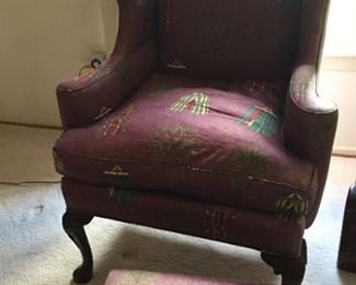 Upholstered armchair with matching footstool.