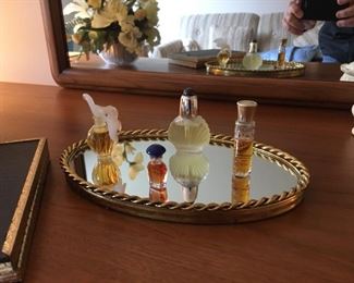 . . . a nice dresser mirror with assorted perfumes