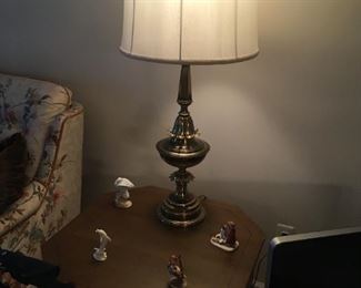 . . . a nice brass lamp with end table and Hummel figures