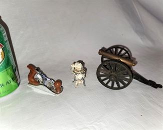 Metal objects. Metal mini toy planer, washing machine salt shaker and cast iron canon. All for $10