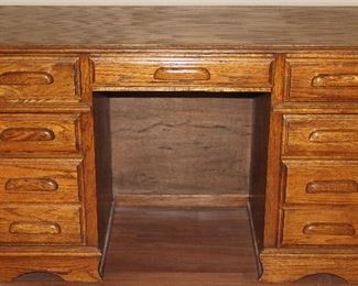 Oak All Wood 7-Drawer Student Desk: 1 center & 3 on each side.    (30.5”H x51”W x 22”D)