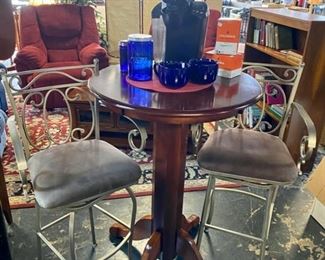 Hightop Wooden Round Table with 2 Metal Upholstered Swivel Bar Chairs and a nice KUERIG Machine