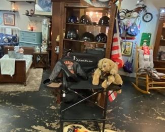 Motorcycle Helmets, Vintage Leather Gloves, Motorcycle Nylon Cover in Bag, and on the top of this wooden shelf is a custom made solid wooden Motorcycle