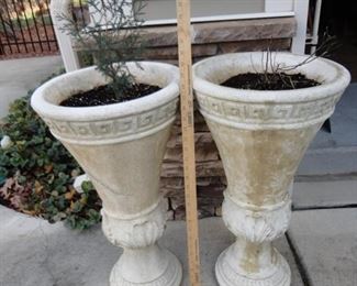 Pair concrete planters ( one chipped on the side)