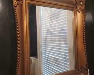 https://ctbids.com/#!/description/share/682291 Beautiful gold ornate mirror. There is a crack on bottom left corner. See pictures for close up. Measurements L 24" W 2" H 27"

