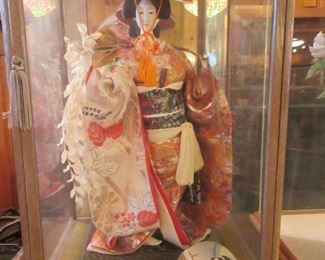 Japanese doll in case 