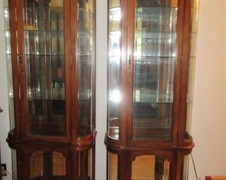 matching pair of mahogany curio cabnits