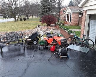 Ariens 17.5 hp 42” lawn tractor, pull behind lawn cart, electric chain saw, chemical spreader, hose reel, Murray Bicycle, outdoor benches, stools, chairs, wrought iron table, shutters