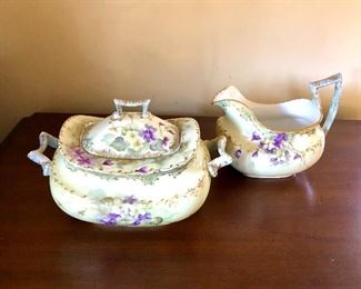 $60 T and V France hand painted sugar bowl and creamer.  Sugar bowl: 7.5" W, 4.5" D, 5" H;  creamer: 6" W, 3.5" D, 5" H.  