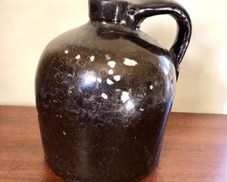 $50 Dark brown jug with peeling chips AS IS.  6" diam, 7.5" H. 