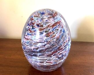 $45 Swirl purplish egg shaped paperweight 