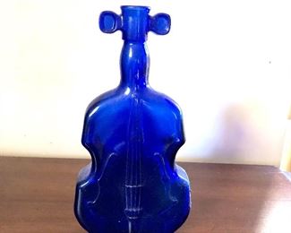 $25 Violin shaped cobalt blue bottle.  4"L; 8"H