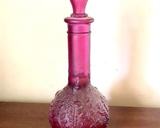 $22 Pink glass bottle with stopper.  8.5"L; 3.5" diam 
