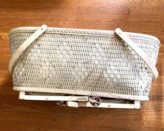 $45 Vintage white wicker bassinet with wheels. 34"l; 19"W; 14"H