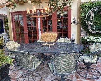 BROWN JORDAN ? Right iron patio set with six chairs and cushions.
 70 x 42
550.00