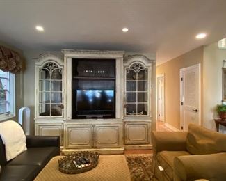 Exceptional Hambersham three piece hand carved made in the USA entertainment center. 7 foot 3 inches tall 
22 inches deep  .Each end cabinet measures 28 inches across center cabinet is 55 across 
3,000.  RETAIL PRICE IS 38,000