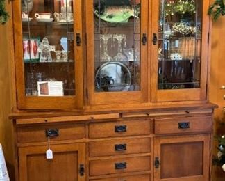 $2500 Mission Arts + Crafts Craftsman China Hutch.  Gorgeous.  Dimensions 66w 19d 84h.   Tiger Oak by Le Meuble Villageois. Hand crafted in Quebec, Canada. Extremely high-quality, on par with Stickley or better. Solid, heavy materials and exceptional craftsmanship. Upper lighted cabinet features glass shelves with plate grooves in wooden frames. The bottom cabinet features many dovetail drawers constructed of solid cedar. 

