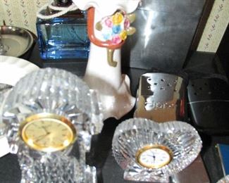 Faceless lime doll and Waterford clocks