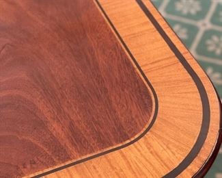 Baker Furniture mahogany Georgian-style double pedestal extension dining room table with inlaid satinwood banding. Late 20th century. Measures 76" L x 48"W. Extends to 133" with three 19" leaves. Photo 3 of 4