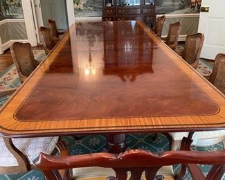 Baker Furniture mahogany Georgian-style double pedestal extension dining room table with inlaid satinwood banding. Late 20th century. Measures 76" L x 48"W. Extends to 133" with three 19" leaves. Photo 1 of 4