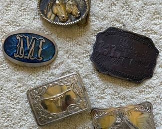 Assorted Western belt buckles.