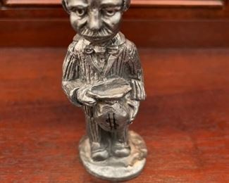 Miniature man figurine.
