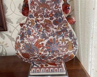 Pair of table lamps with lucite base and persimmon ornamentation. Measures 29" H x 10" W. Photo 2 of 3.