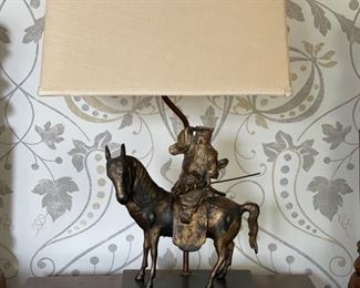 Table lamp with horse and rider base.