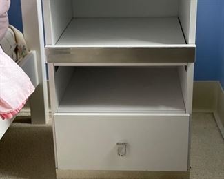 Laminate side table. Measures 18" W x 17" D x 27" H.