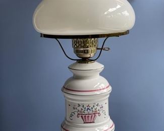 Table lamp with glass oil lamp shade.