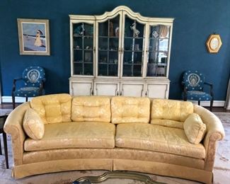 Curved barrel back sofa upholstered in yellow silk damask fabric. Measures 93" L x 34" D. Seat height measures 18" H.