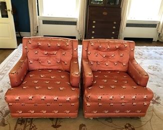 Club chairs upholstered in coral silk fabric on casters. Down cushions - 4 available. Each measures 28" W x 32" D x 30" H.