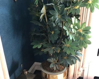 Faux plant in brass planter.