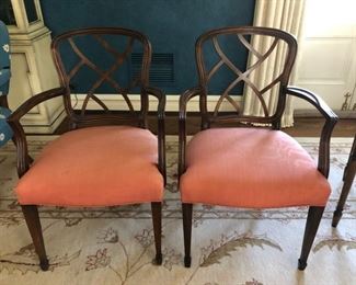 Pair of vintage upholstered armchairs with fretwork backs.
